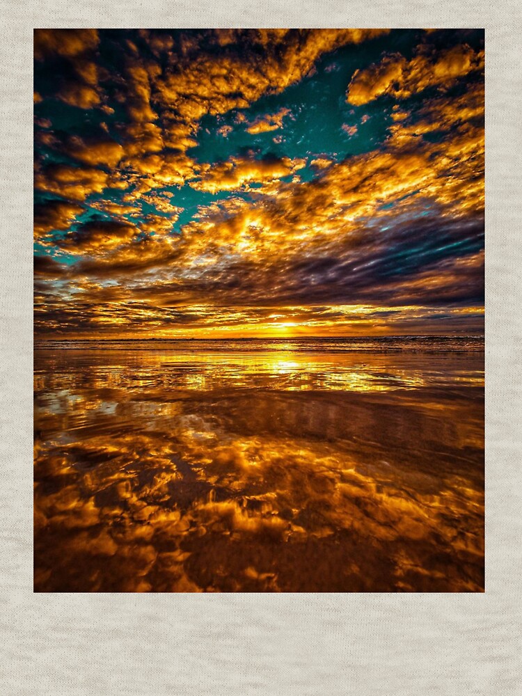 golden sky reflection by ocean-wave